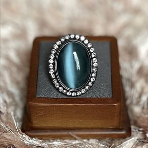 Beautiful big teal stone cocktail ring in black.